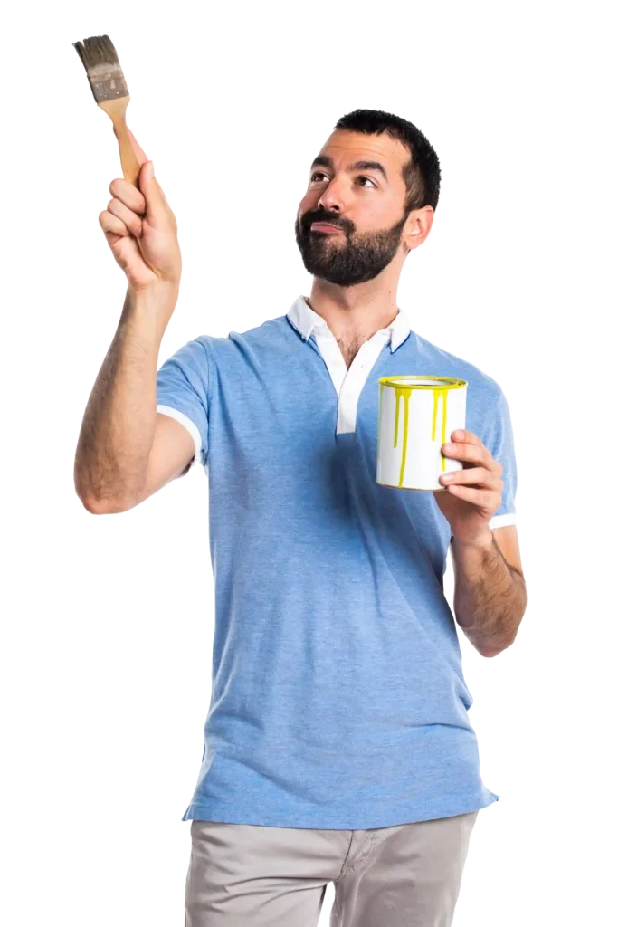 man with blue shirt holding paint pot